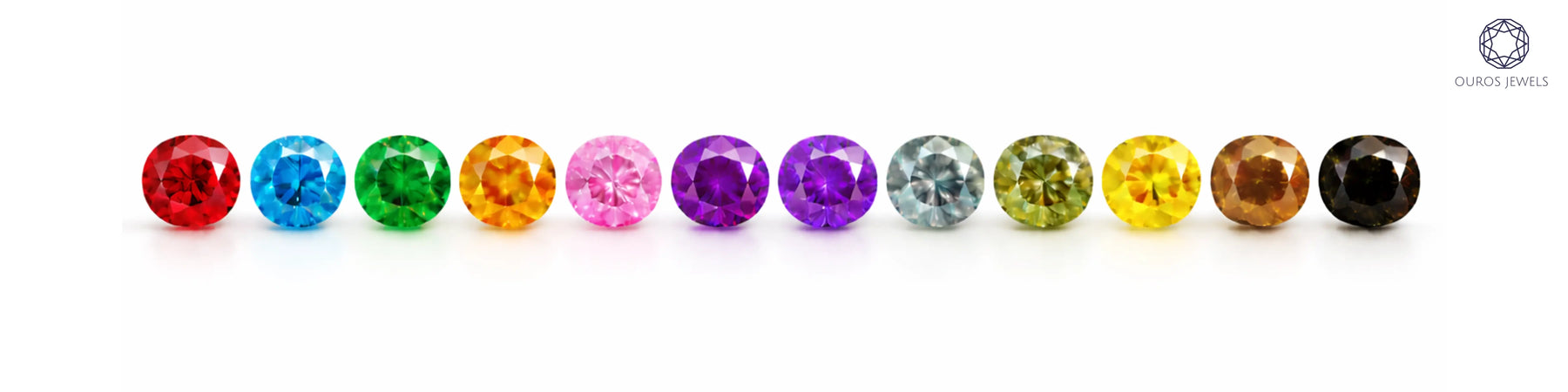 All 12 fancy coloured diamonds ranked by rarity — red, blue, green, orange, pink, violet, purple, grey, olive, yellow, brown, and black round-cut diamonds by Ouros Jewels
