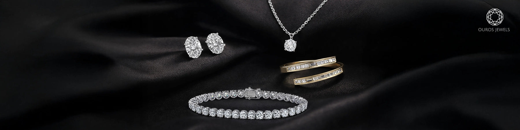 Lab grown diamond jewelry capsule wardrobe with oval stud earrings, solitaire pendant, tennis bracelet, and gold rings by Ouros Jewels