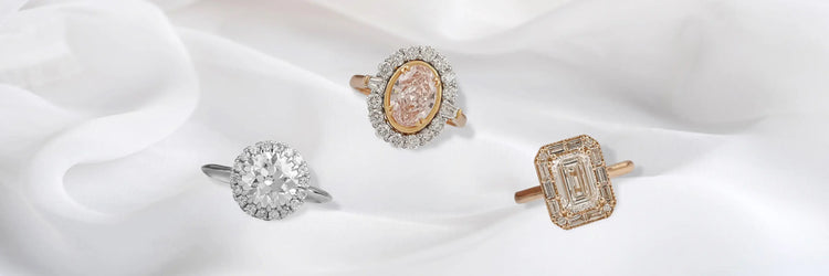 image showing halo ring featuring a colored lab-grown diamond heart, cushion, and oval shapes, Beautifully set for a sparkling finish 