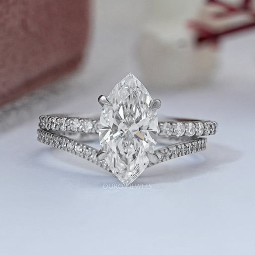 front view of marquise-cut lab diamond solitaire bridal ring set on grey fabric