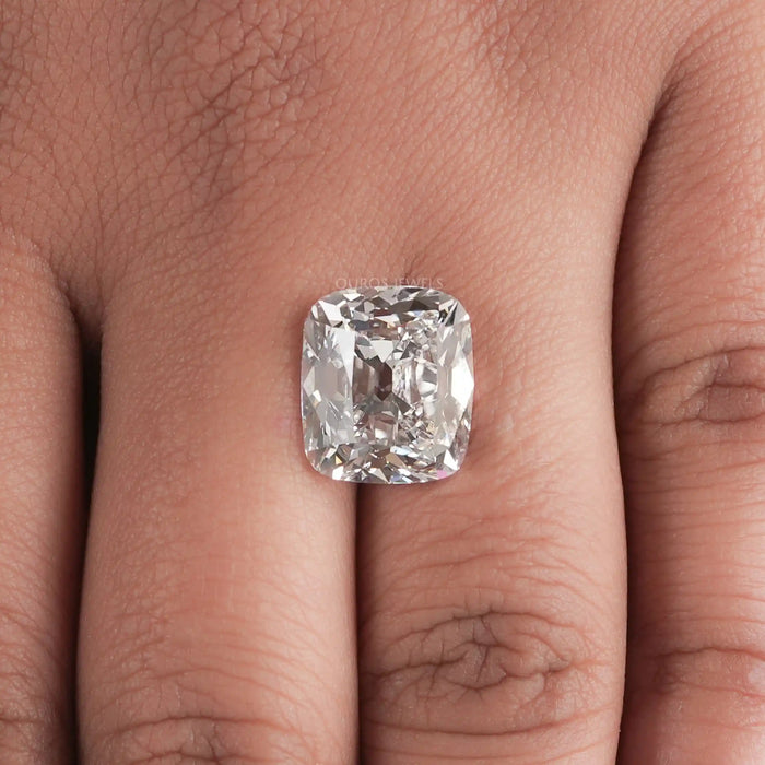 10 Carat IGI Certified Old Mine Cushion Cut Diamond placed on a finger.