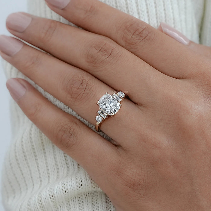 elongated cushion and baguette cut diamond five stone wedding ring on model's finger