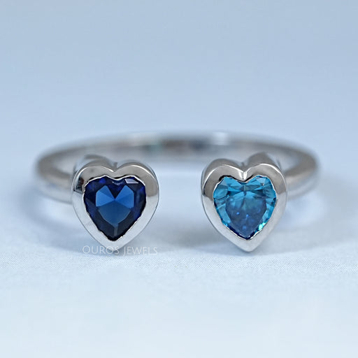top view of blue sapphire and zircon heart gemstone toi et moi wedding ring