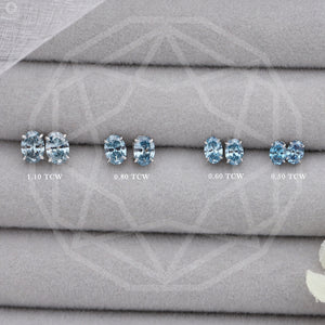 Blue Oval Cut Lab Diamond Stud Earrings in various sizes: 1.10 TCW, 0.80 TCW, 0.60 TCW, and 0.50 TCW.