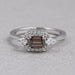 front view of chocolate emerald-cut diamond three-stone colored engagement ring