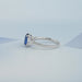 side view of sapphire cushion gemstone with trapezoid diamond 3 stone wedding ring