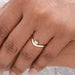 round cut lab diamond curved band wedding ring on model's hand