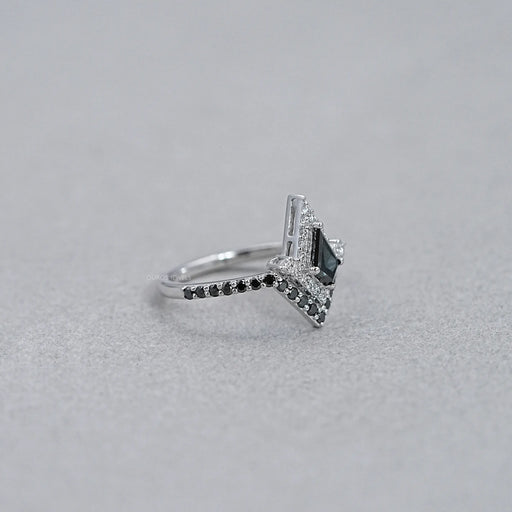 side view of black kite-cut lab diamond curved halo wedding ring on grey fabric