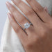 cushion cut lab diamond solitaire hidden halo engagement ring on model's finger
