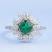 cushion cut gemstone with pear diamond halo engagement ring's front view