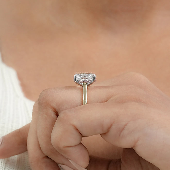 cushion-cut diamond pink hidden halo solitaire colored wedding band on model's finger