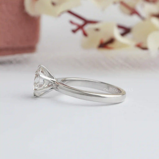 side view of six prong round cut diamond solitaire engagement ring white gold