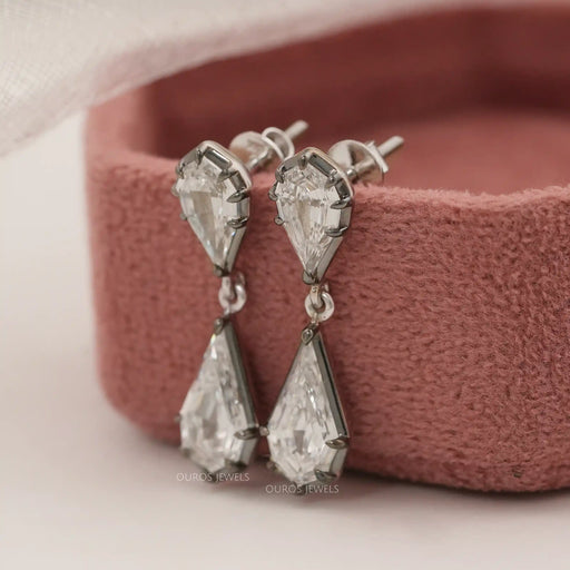 side view of step cut pear and kite diamond collet setting flat back drop earrings