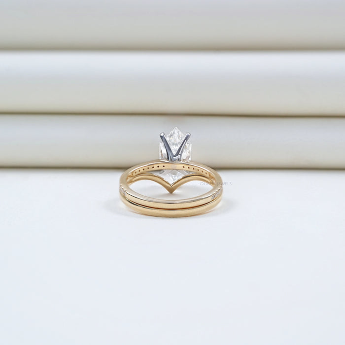 back view of dutch marquise-cut diamond curved engagement ring with 2 yellow bands