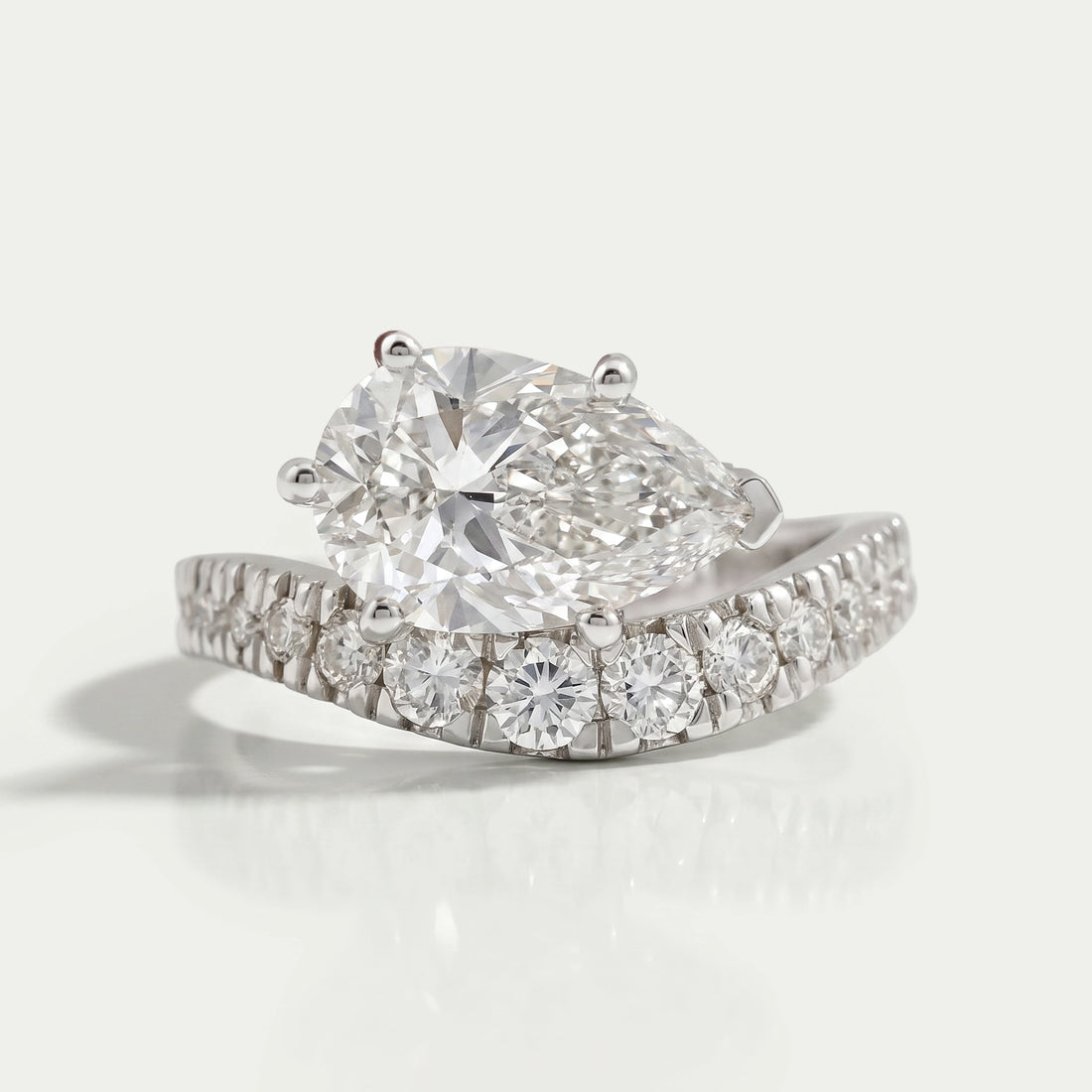 East West Pear Cut Diamond Wave Ring Ring