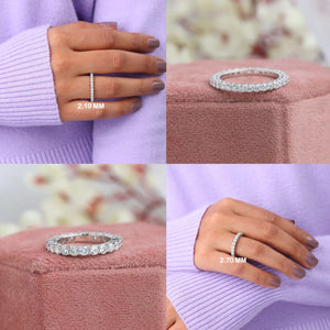 Round Cut Lab Diamond Eternity Wedding Band collage showing four views: two bands on a woman's finger, one with a 2.10 mm width and another with a 2.70 mm width, and two bands displayed on a pink velvet boxes with a soft floral background.