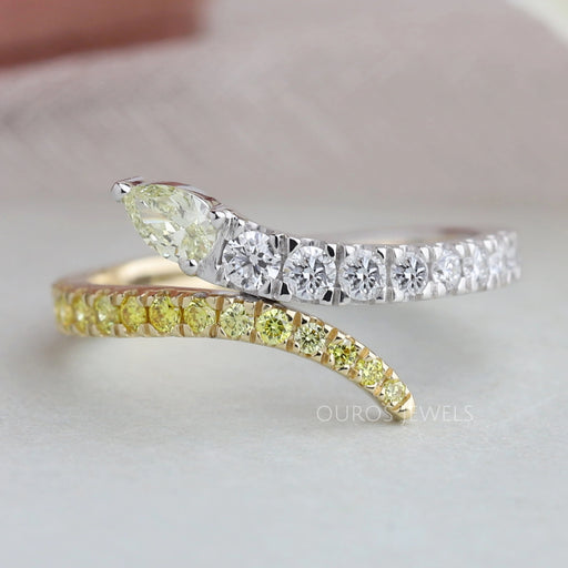 front view of pear and round-cut lab diamond bypass colored wedding band