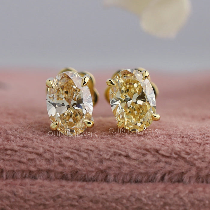 Oval Cut Diamond Stud Earrings In Yellow