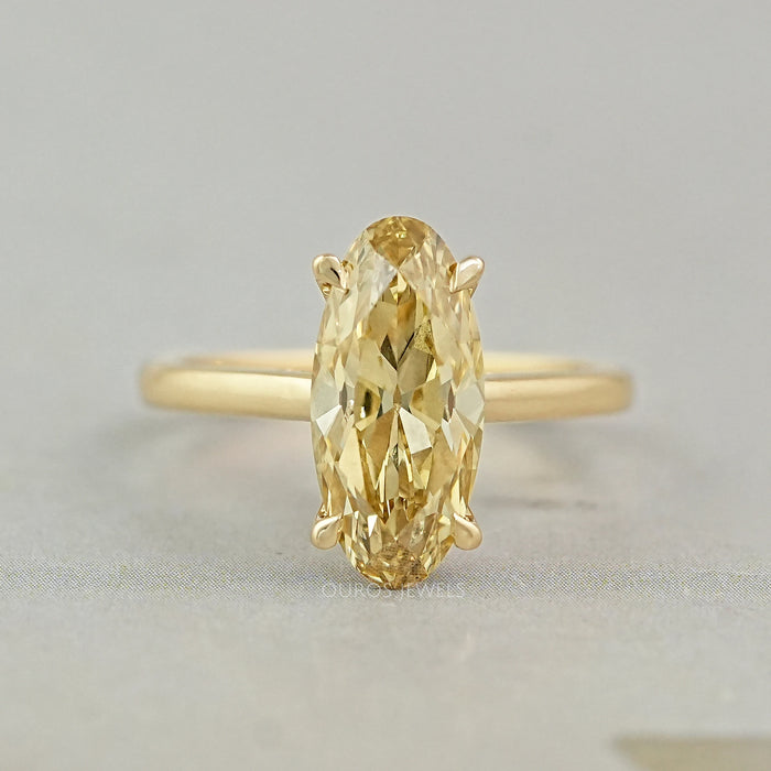 front view of old mine moval cut yellow diamond engagement ring