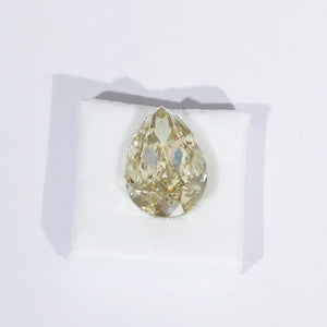 Fancy Intense Yellow Modified Cut Diamond on White Surface