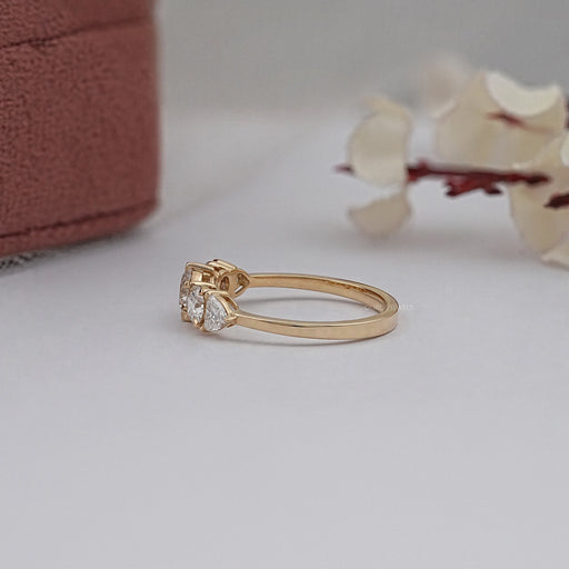 side view of round and heart cut lab diamond five stone engagement ring