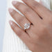 emerald-cut lab diamond half bezel set solitaire engagement ring in finger