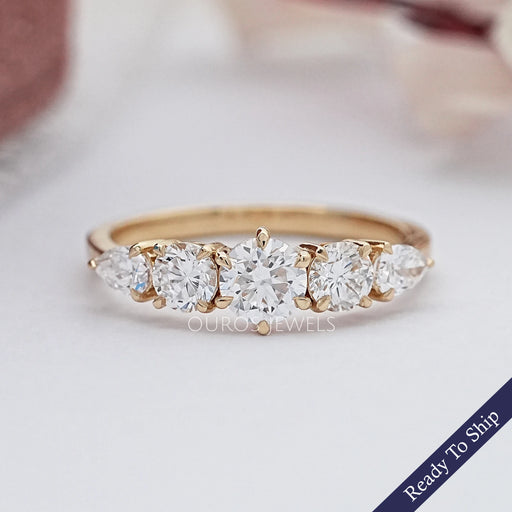 front view of round and pear cut lab diamond five stone engagement ring