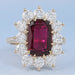 front view of ruby elongated cushion gemstone with round halo engagement ring