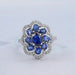 blue sapphire oval diamond floral halo engagement ring's front view