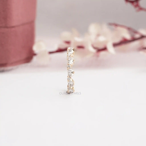 stand up view of half moon and round diamond eternity wedding ring yellow gold