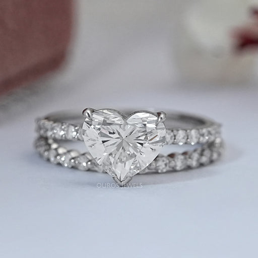 front view of square radiant-cut diamond solitaire bridal ring set on grey fabric