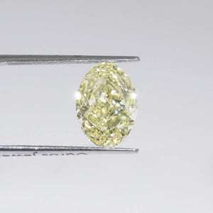 Modified Lab Created Yellow Diamond in a Tweezer 