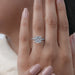 cushion cut lab diamond solitaire hidden halo engagement ring in finger