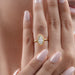 marquise cut lab diamond bezel set engagement ring worn on finger