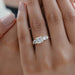 princess cut diamond five stone engagement ring in yellow gold band on model's finger