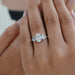 oval and trillion cut lab diamond five stone engagement ring on model's finger