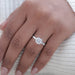 square old mine cushion cut lab diamond 3 stone engagement ring in finger