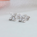 flower style stud earrings on the white plain surface