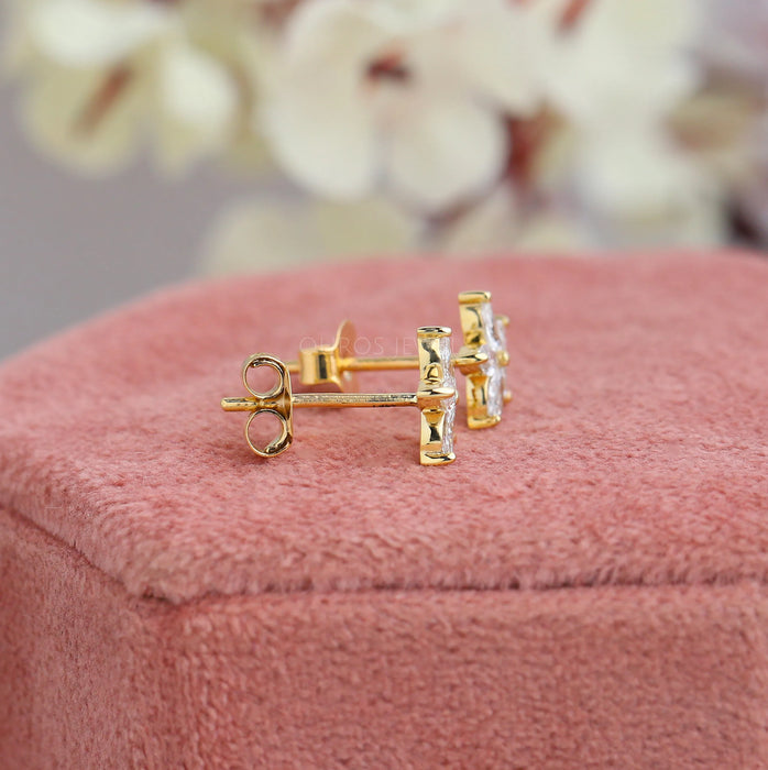 side view of marquise cut lab created diamond flower stud earrings yellow gold