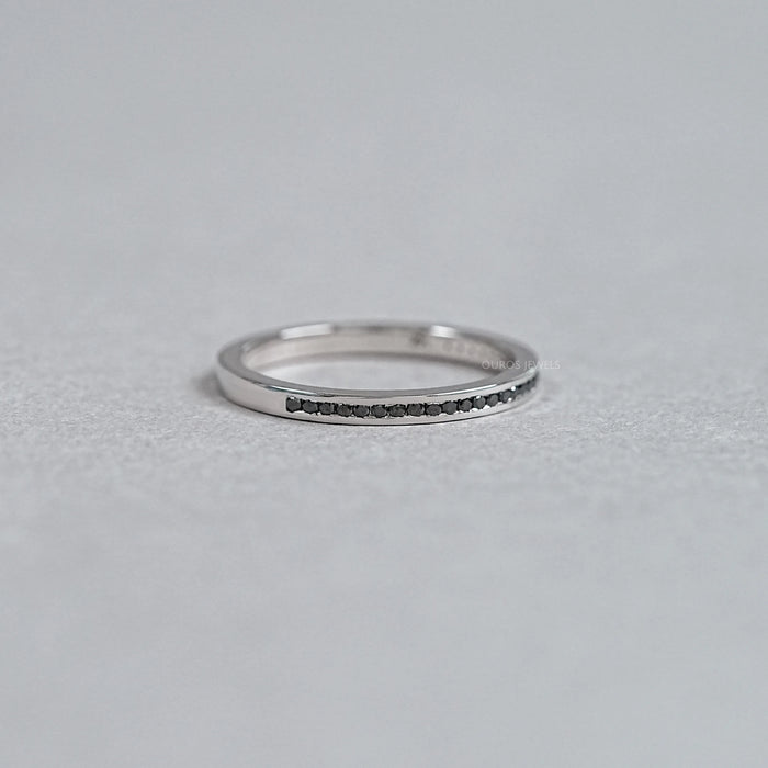 right view of black round-cut diamond channel-set half eternity band engagement ring