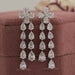 front view of pear shaped lab grown diamond dangle drop earrings silver