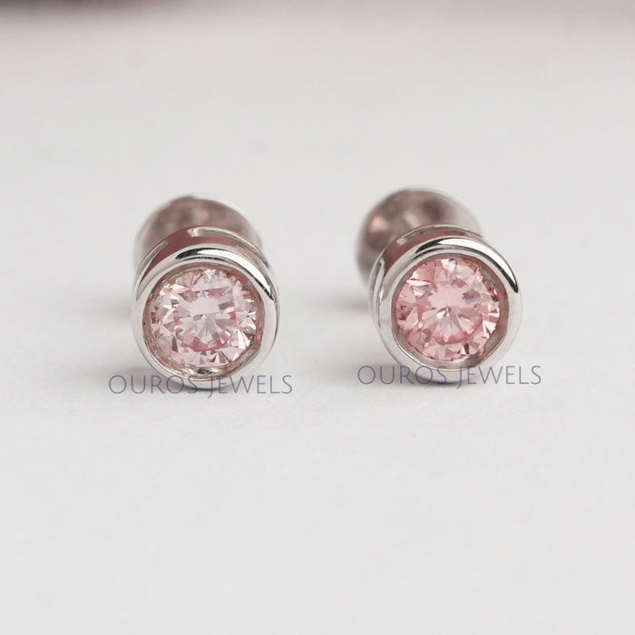 front view of pink round lab grown diamond bezel set stud earrings rose gold