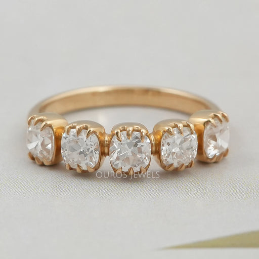 front view of old mine cushion cut five stone wedding ring with yellow gold band
