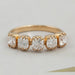 front view of old mine cushion cut five stone wedding ring with yellow gold band