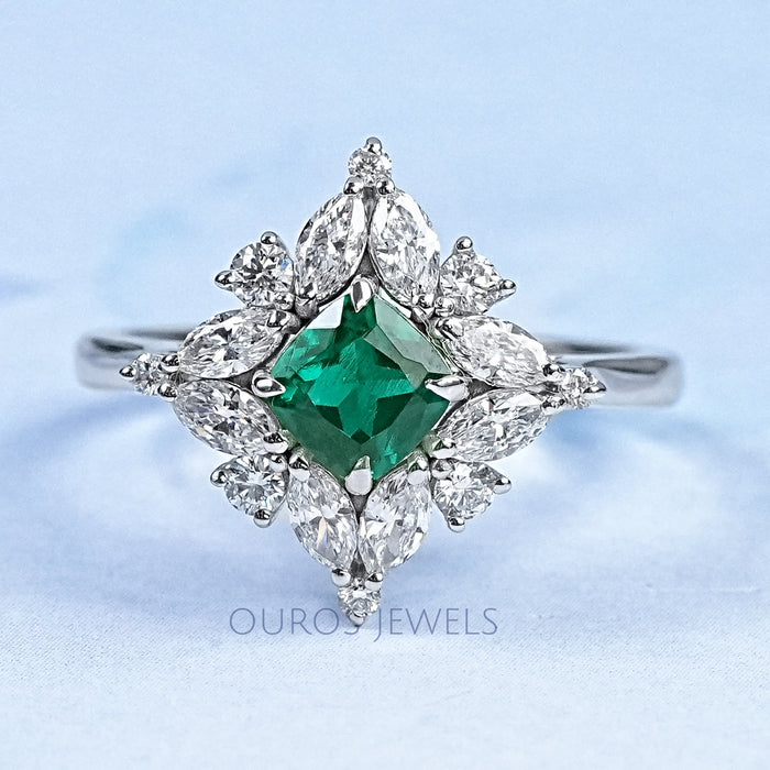 green cushion gemstone with pear diamond halo wedding ring's front view