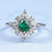 green cushion gemstone with pear diamond halo wedding ring's front view
