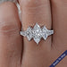 front view of marquise cut lab diamond five stone engagement ring in finger