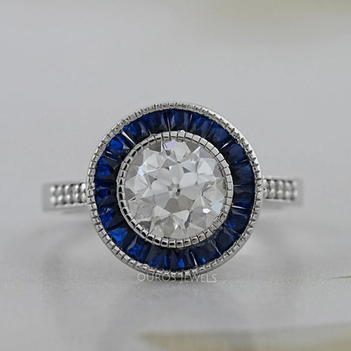 OEC round diamond surround with sapphire baguette halo wedding ring's front view