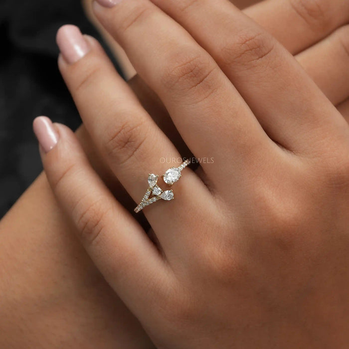 close view of oval-cut lab-grown diamond open cuff wedding band on model's finger