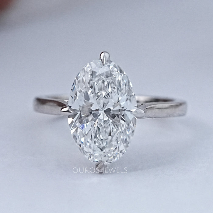 top view of 3 carat oval cut lab grown diamond hidden halo solitaire ring